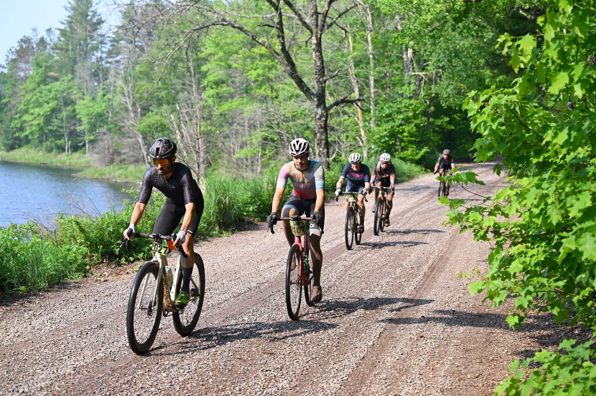 Cyclists riding on a quiet gravel road